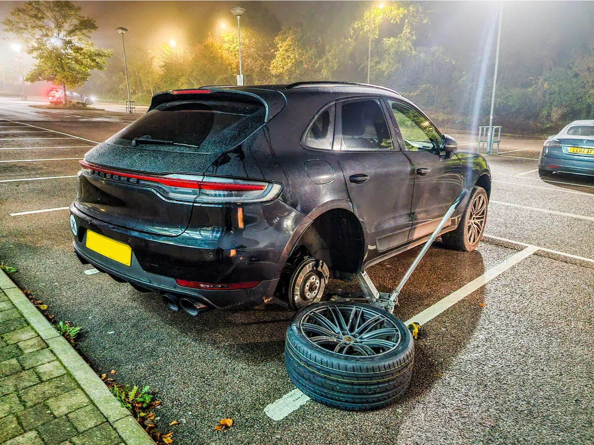 Mechanics working on a tyre