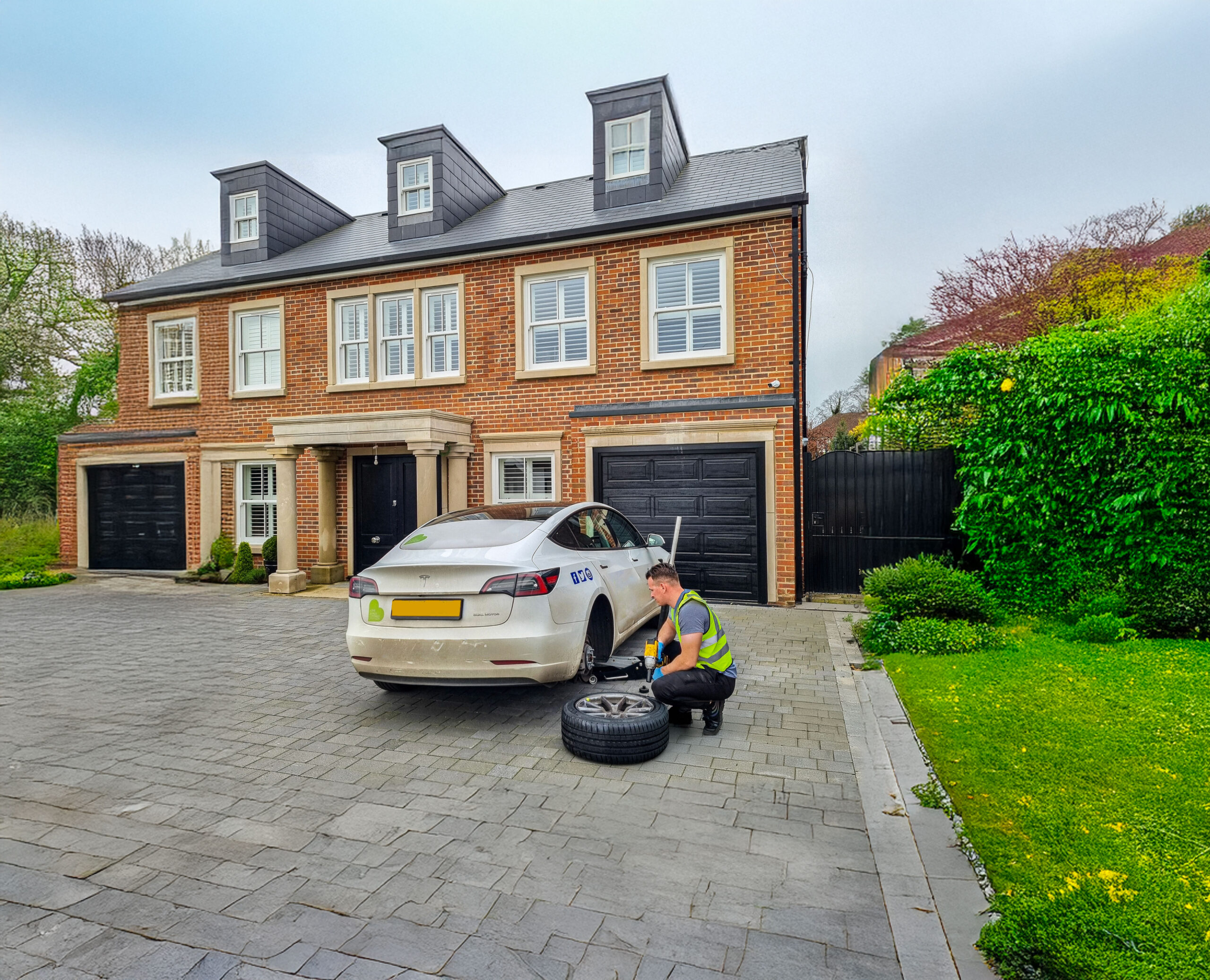 Mechanics working on a tyre