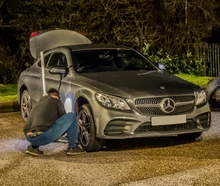 Mechanics working on a tyre