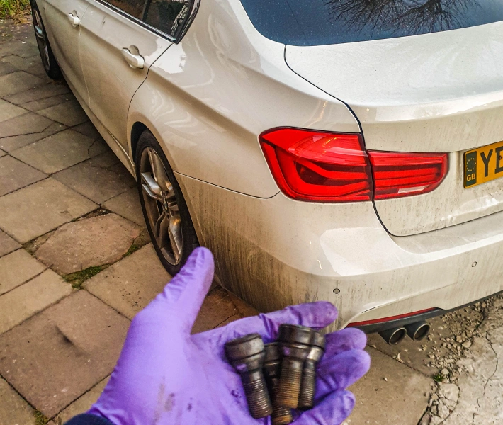 Mechanics working on a tyre