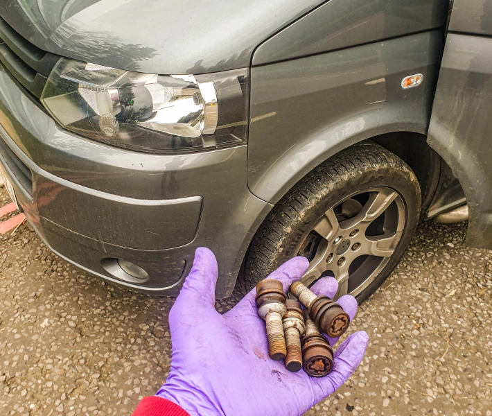 Mechanics working on a tyre