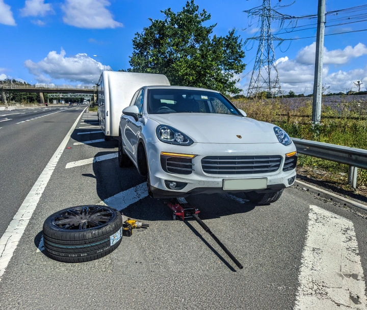 Mechanics working on a tyre