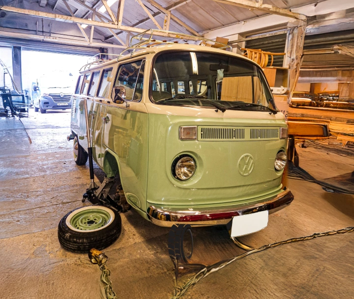 Mechanics working on a tyre