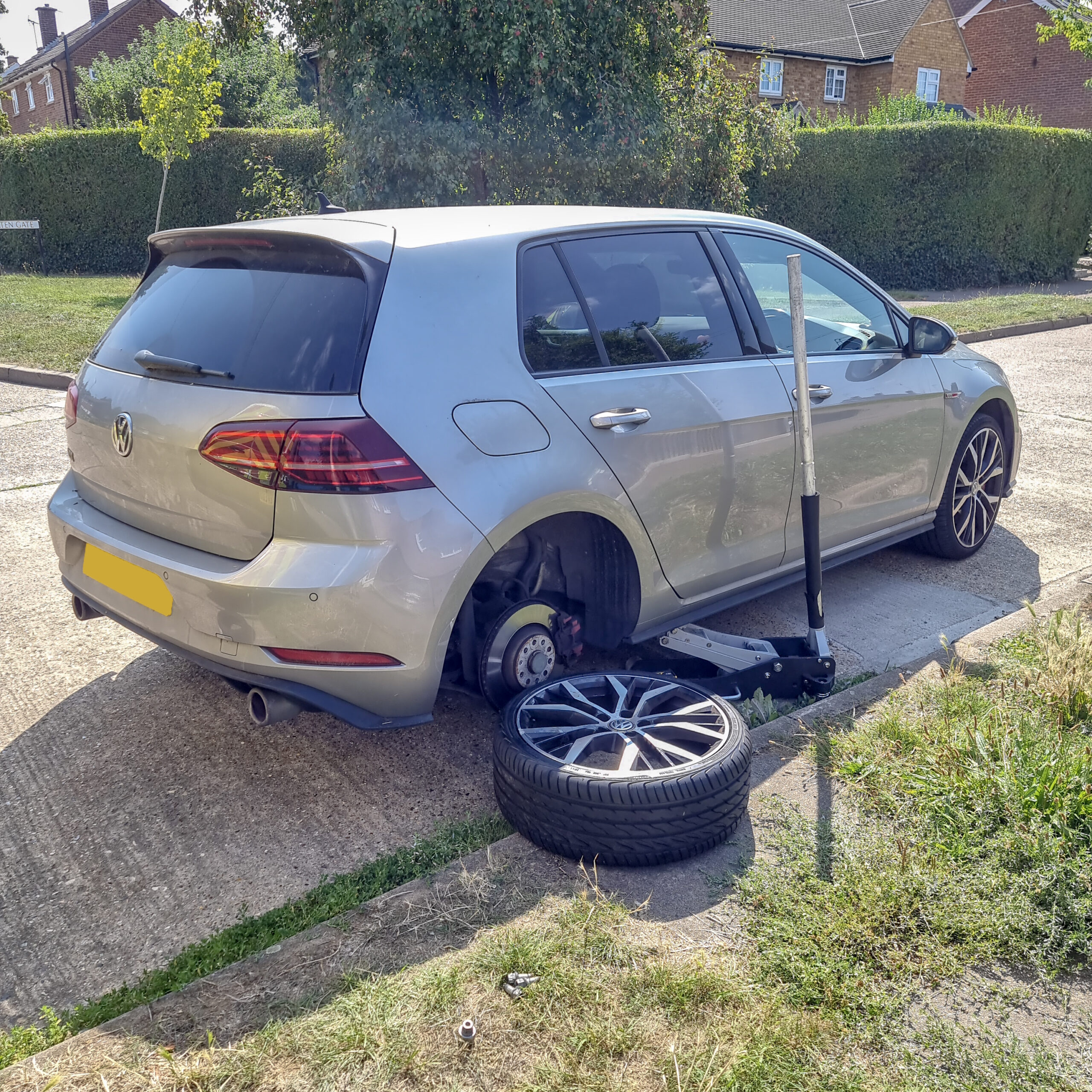 Mechanics working on a tyre
